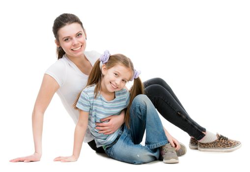 two beautiful sisters smiling on white background