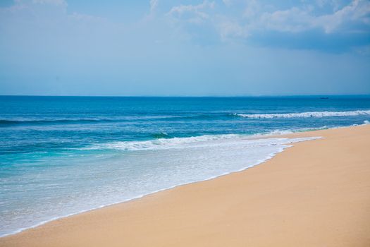 Beautiful surfing tropical sand beach on sunny summer day