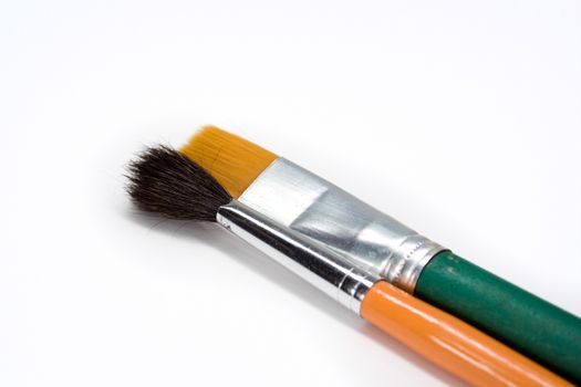 Two artistic paint brushes studio isolated on white background