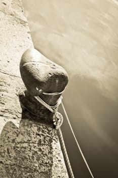 Old stone pier detail rope