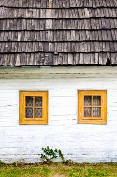 Detail of colorful windows on old traditional house, Vlkolinec village, Slovakia