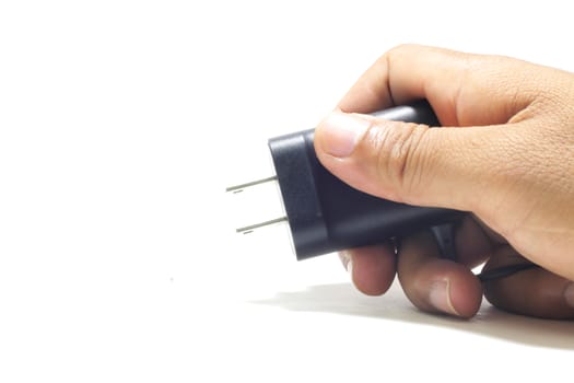 isolated white background hand holding electric plug