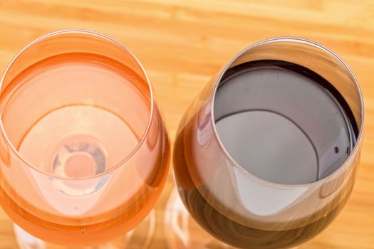 Glasses of Red and Pink Wine on Wooden Table, top view