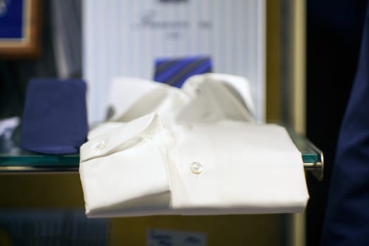 Close up of white male shirts exposed in the clothes shop