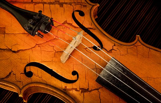 Close-up detail of violin in filtered style as cracked paint