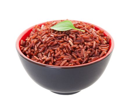 A bowl of Red Cargo Rice garnished with a single leaf of lemon basil.  Shot on white background.