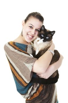 A beautiful Snowshoe Lynx Point Siamese cat being hugged by her female owner.  Shot on white background.