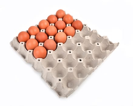 eggs in paper tray on white background