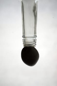 picture of glass bottle and stone