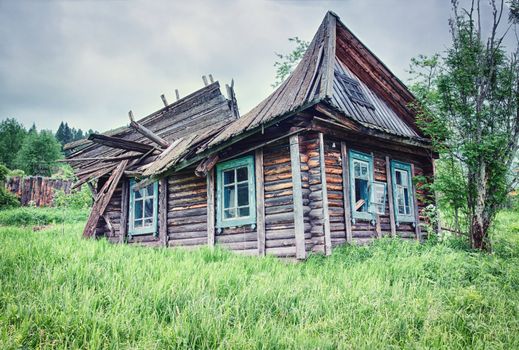 Old small abandoned and ruinous country house in Russia