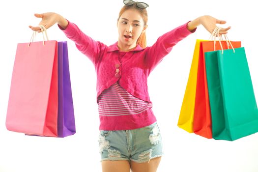 Portrait of young asian woman holding shopping bags isolated on white background