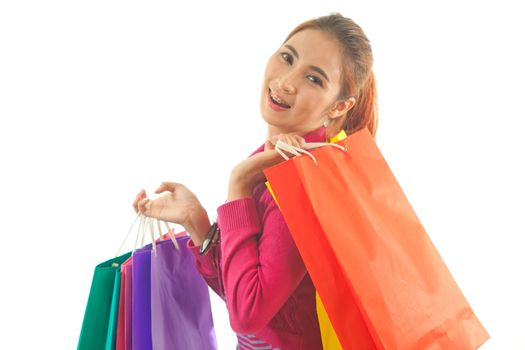 Portrait of young asian woman holding shopping bags isolated on white background