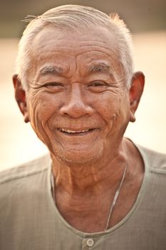 Portrait Of Happy Senior Asian Man At Outdoor