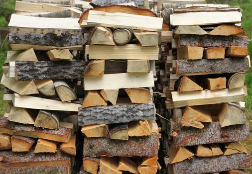 Split firewood heap stacked chopped timber wood