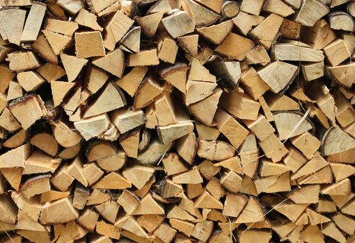 Split firewood heap stacked chopped timber wood