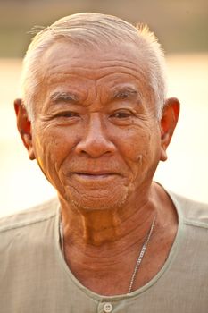 Portrait Of Happy Senior Asian Man At Outdoor