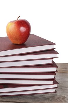 Book with apple isolated on white  background