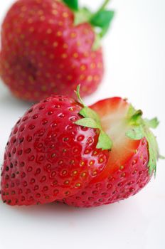 Healthy red strawberry fruit sliced isolated on the white background 