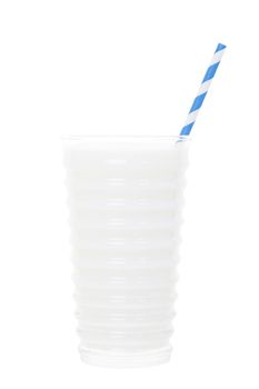 A nice tall, cold, glass of white milk with a blue & white striped straw.  Isolated with clipping path.