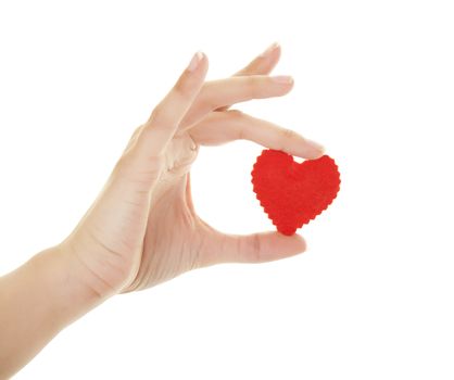 A female hand holding a homemade red felt heart.  Shot on white background.
