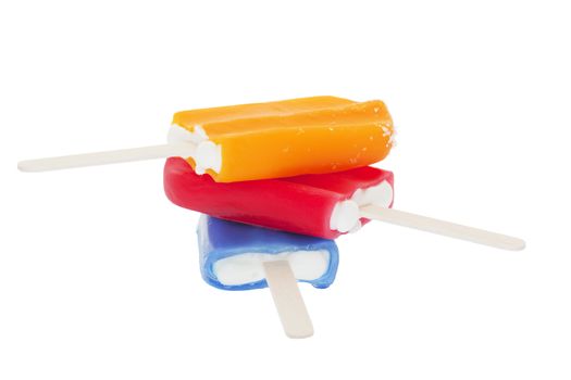 An ice cold stack of fruit flavored creamsicles.  Shot on white background.