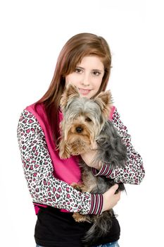 attractive smiling young girl with long hair wearing pink dress with her best friend yorkshire terrier isolated white background