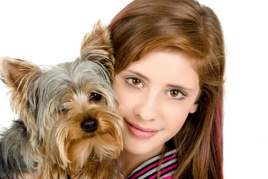 attractive smiling young girl with long hair wearing pink dress with her best friend yorkshire terrier isolated white background