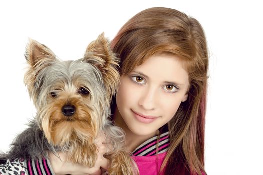 attractive smiling young girl with long hair wearing pink dress with her best friend yorkshire terrier isolated white background