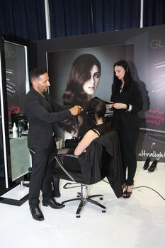 Model during hairdressing-styling  at 23th iinternational fair and congress of cosmetics, solarium, equipment, wellness, spa and hair care, the largest beauty fair in South-east Europe, The touch of Paris, 26th and 27th April 2014. Belgrade,Serbia