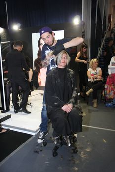 Model during hairdressing-styling  at 23th iinternational fair and congress of cosmetics, solarium, equipment, wellness, spa and hair care, the largest beauty fair in South-east Europe, The touch of Paris, 26th and 27th April 2014. Belgrade,Serbia
