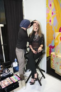 Model during hairdressing-styling  at 23th iinternational fair and congress of cosmetics, solarium, equipment, wellness, spa and hair care, the largest beauty fair in South-east Europe, The touch of Paris, 26th and 27th April 2014. Belgrade,Serbia
