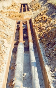 trench with old pipes heat conductor