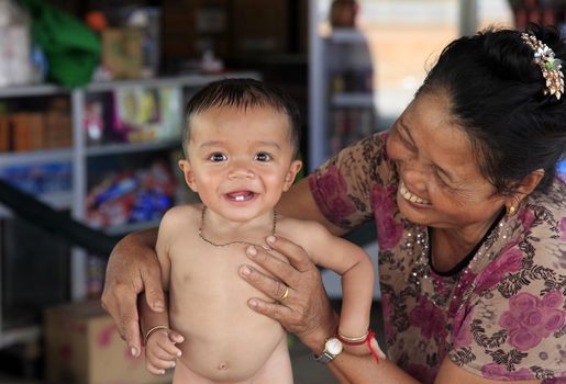 SIEM REAP, CAMBODIA - APRIL 24: unknown little boy in a poor village in Siem Peap 24 April 2014, Cambodia