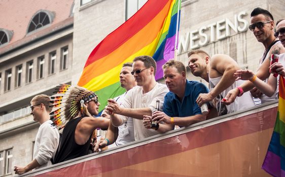 BERLIN, GERMANY - JUNE 21, 2014:Christopher Street Day.An unidentified men at the gay pride parade. Crowd of people participate in the parade celebrates gays, lesbians, bisexuals and transgenders in Berlin.