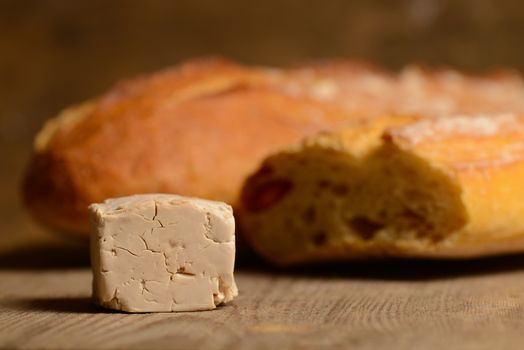 Yeast and bread on wood