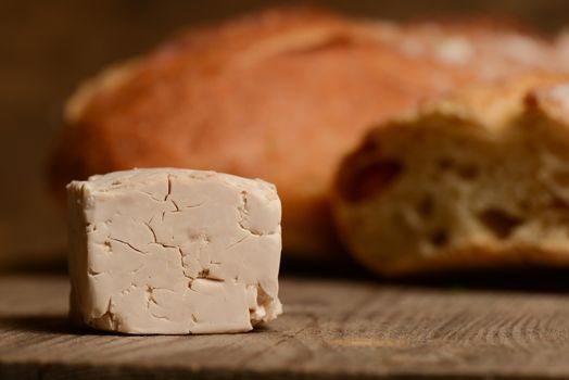 Yeast and bread on wood