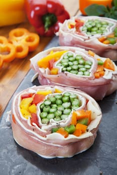 Pork pinwheels stuffed with fresh asparagus, peppers, and mozzarella cheese.
