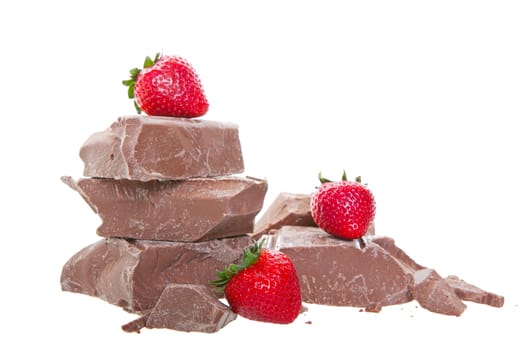 Fresh, mouth-watering, strawberries on top of thick chunks of milk chocolate.  Shot on white background.