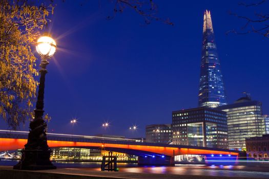The Shard and London Bridge spanning over the River Thames.