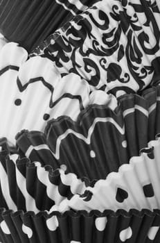 Abstract of  patterned cupcake wrappers in black and white.  Macro.