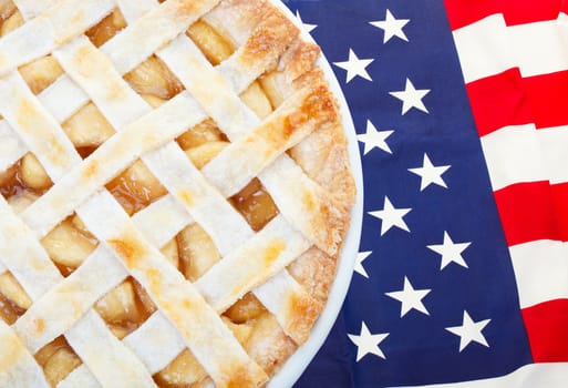 As American as apple pie as the saying goes.  Fresh apple pie on an American flag.