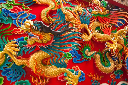 China Dragon statue on the wall background