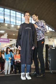 Model during hairdressing-styling  at 23th iinternational fair and congress of cosmetics, solarium, equipment, wellness, spa and hair care, the largest beauty fair in South-east Europe, The touch of Paris, 26th and 27th April 2014. Belgrade,Serbia