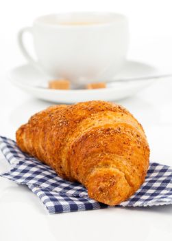 Croissant with caffee cup. Isolated on white backgroun