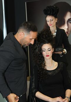 Model during hairdressing-styling  at 23th iinternational fair and congress of cosmetics, solarium, equipment, wellness, spa and hair care, the largest beauty fair in South-east Europe, The touch of Paris, 26th and 27th April 2014. Belgrade,Serbia