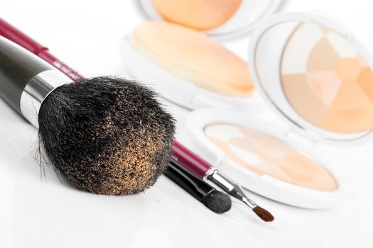 compact powder and black brush isolated