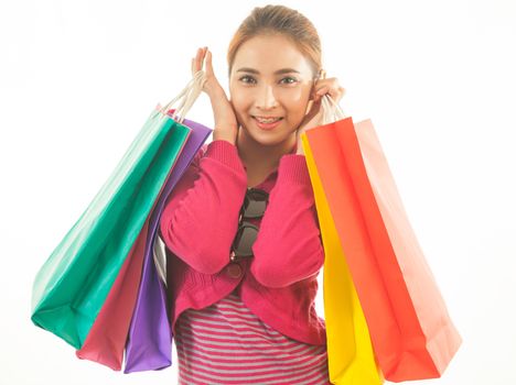 Portrait of young asian woman holding shopping bags isolated on white background