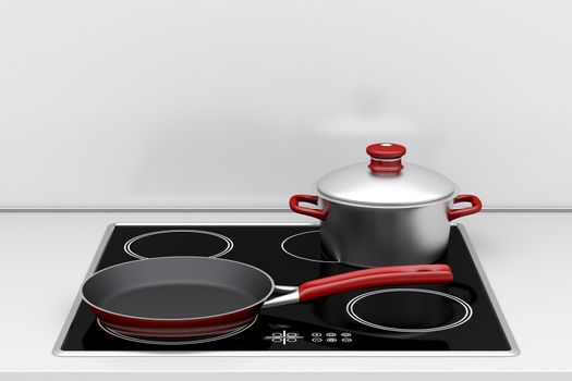 Pot and frying pan at the induction stove