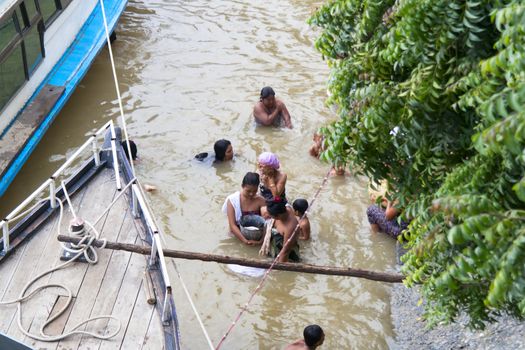 Washing in the Irrawaddy River, Mandalay Myanmar 21.08.2013  Editorial