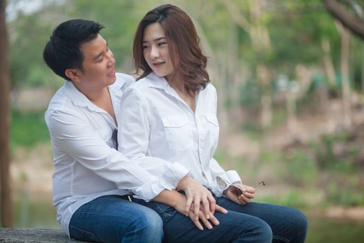 Happy young asian couple in love outdoor